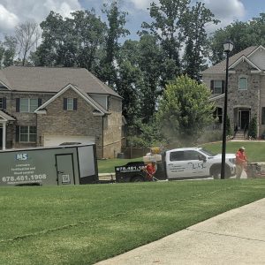 Expert lawn mowing crew maintaining a large yard in Dacula