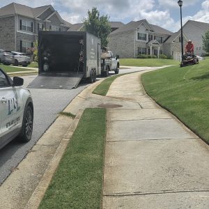 Precision lawn mowing with striped pattern in Flowery Branch